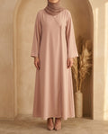 Blush side button abaya with crossover wrap neckline, front view